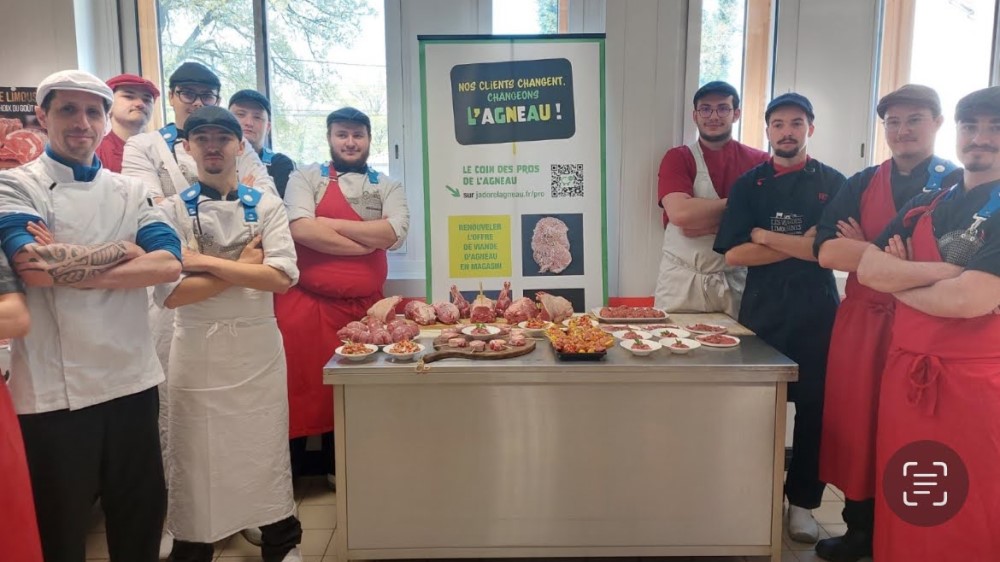 A group of butchery students by a table of lamb products